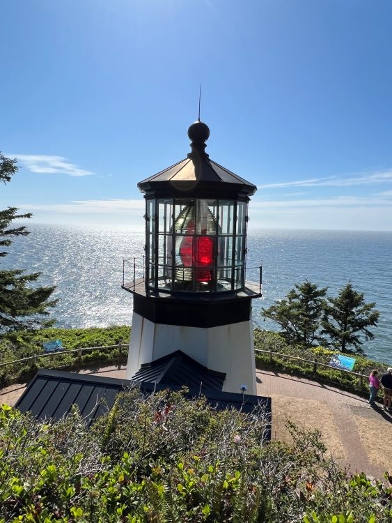 Cape Meares Lighthouse against ocean backdrop