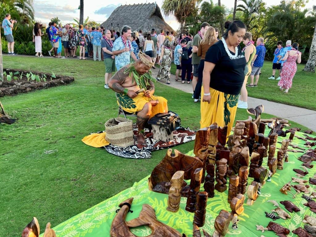 Vendors selling wooden crafts at Old Lahaina Luau