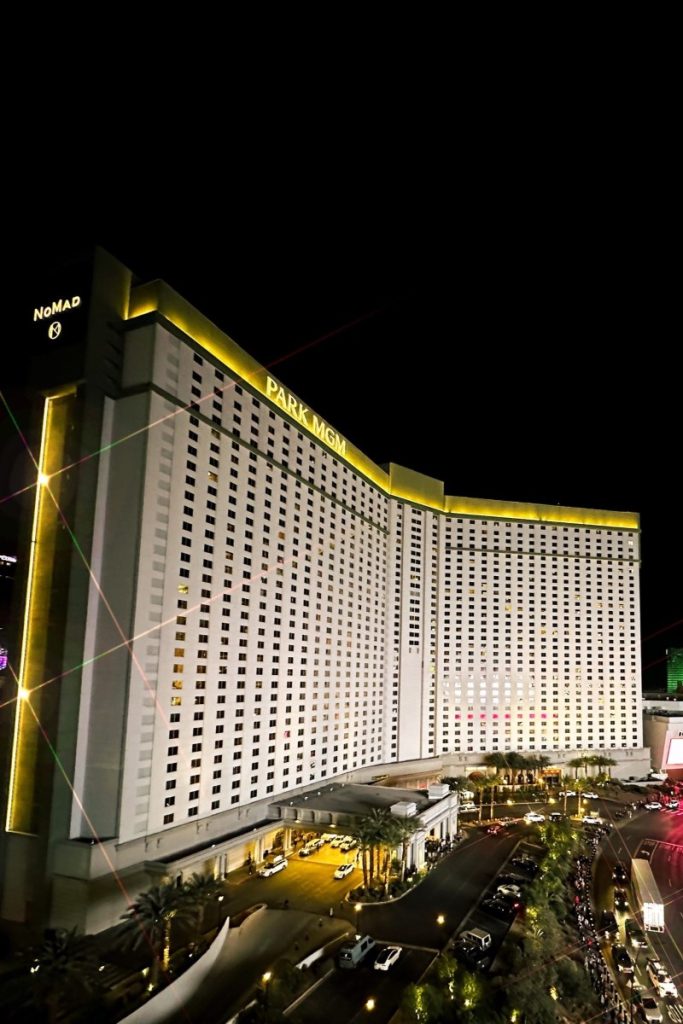 Tall and wide hotel building with Park MGM written on top. 