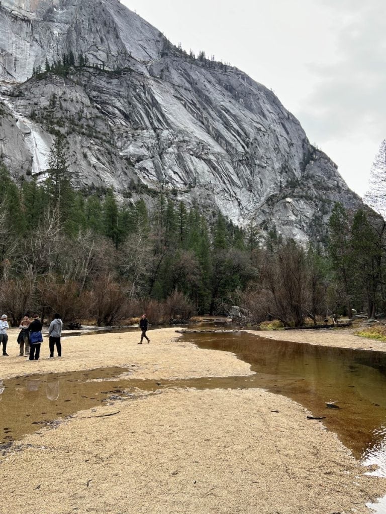 People walking on the dry Mirror Lake bed