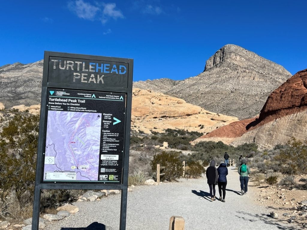 Hikers at the trailhead of Turtlehead Peak trail at Red Rock Canyon
