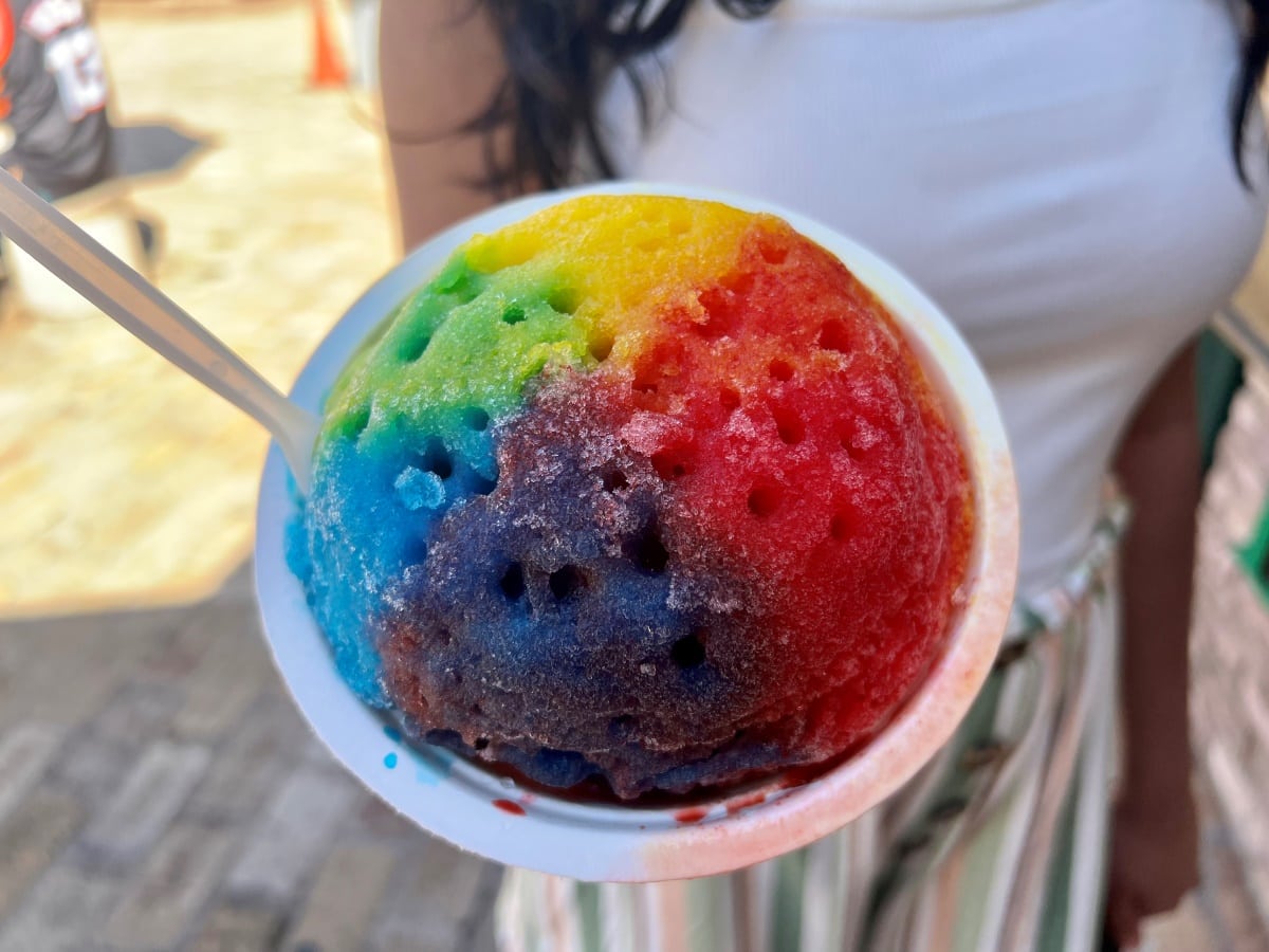 Rainbow colored shave ice in a bowl