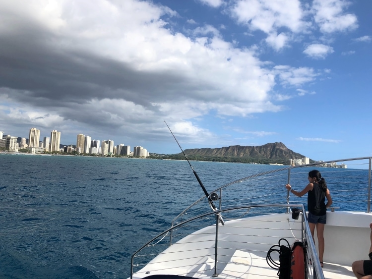 Catamaran boat in ocean with views of Waikiki and Diamond Head