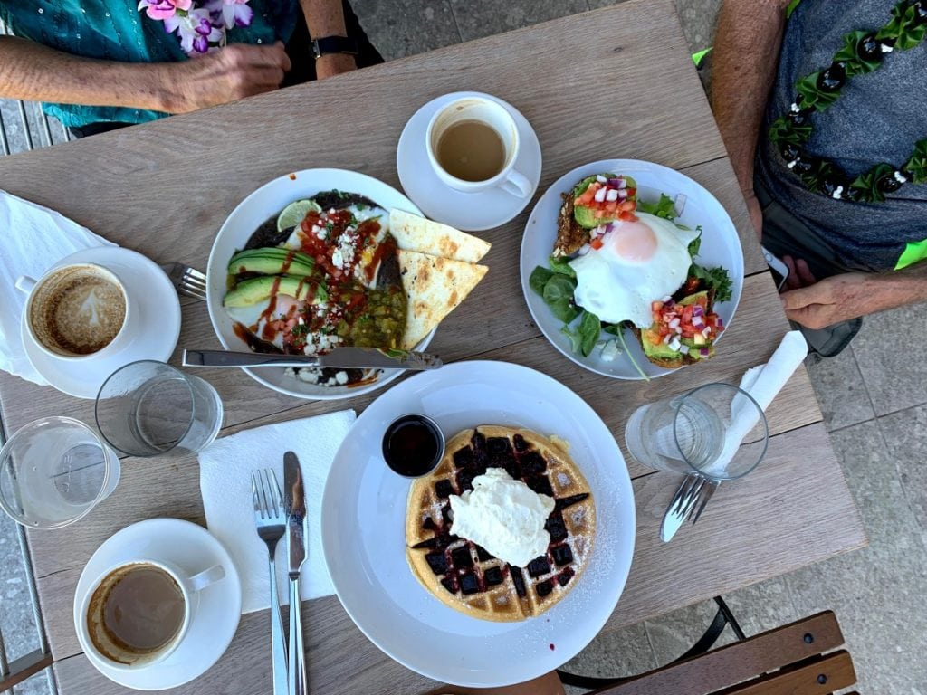 breakfast in Kihei - several breakfast dishes on a table with coffee