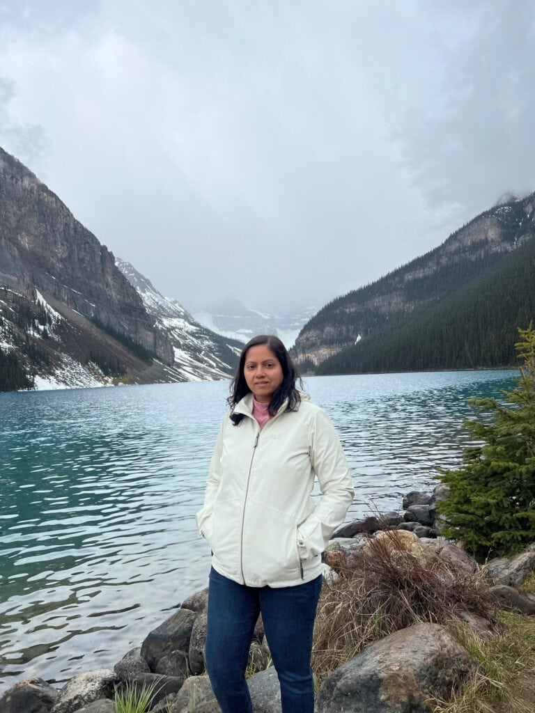 Anu posing in front of Lake Louise