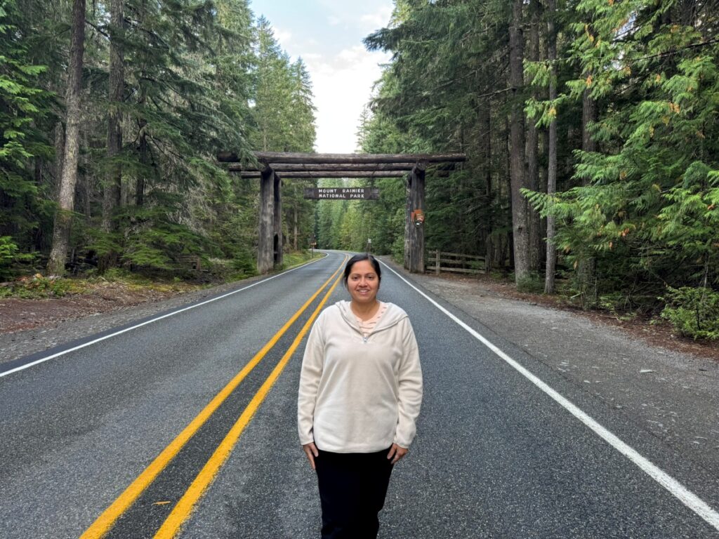 Me in front of Mt. Rainier National Park sign