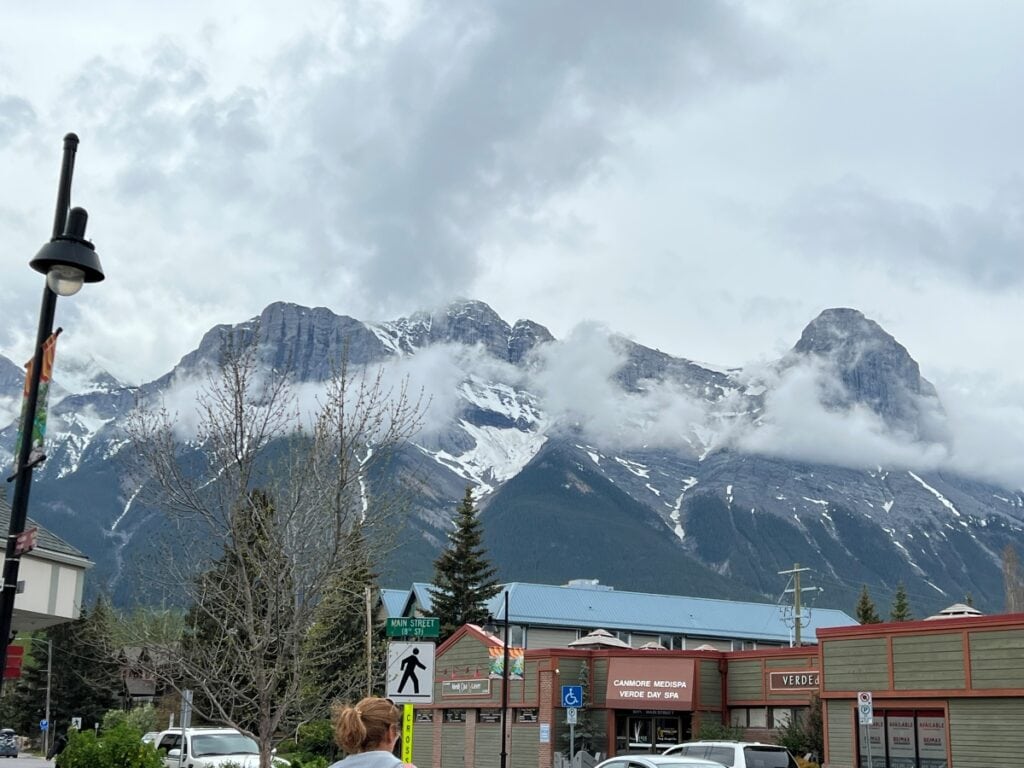 snow covered mountain peaks soaring above a mountain town