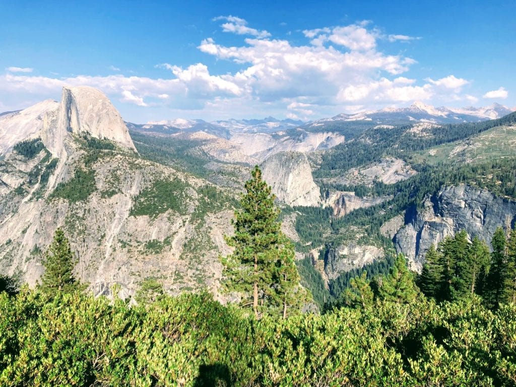 Epic view of Half dome and nearby cliffs from Glacier Point in Yosemite