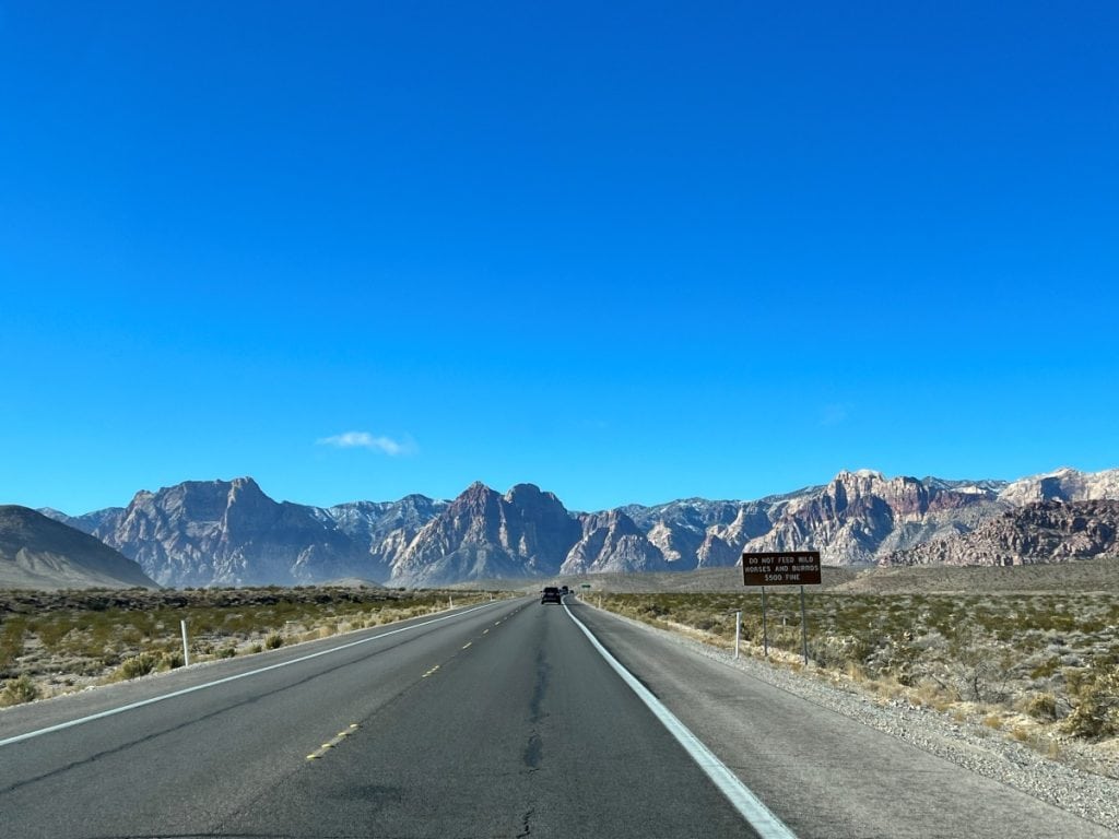 scenic drive from Las Vegas to Red Rock Canyon with mountains in the background