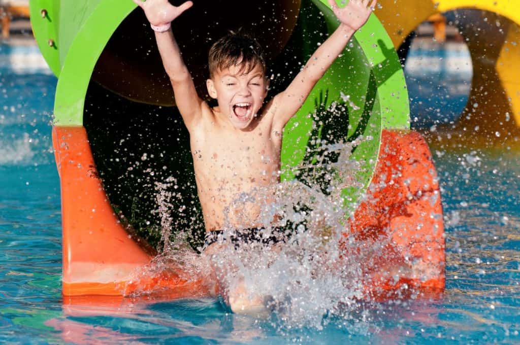 kid having fun at waterslide