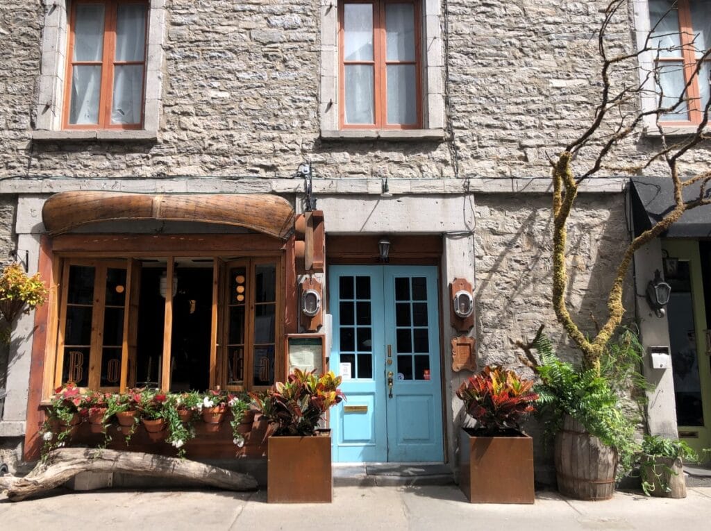 A pretty building in Montreal with a blue door