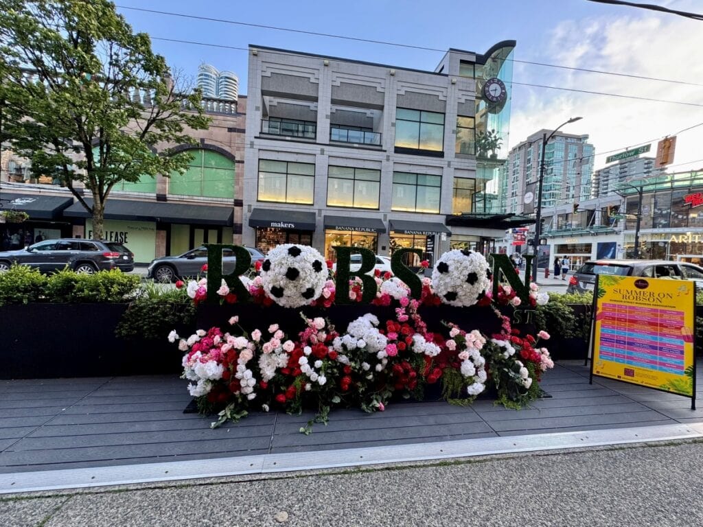 Robson Street Sign decorated with flowers