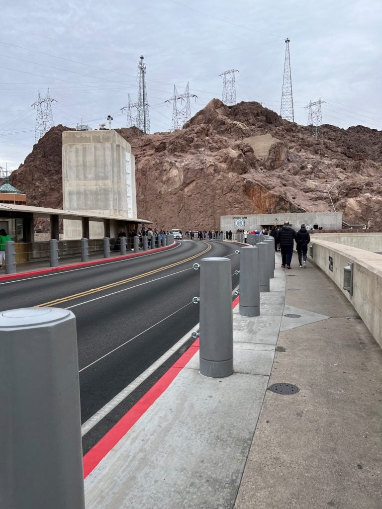 Top of the Hoover dam with road for cars and walkway for visitors