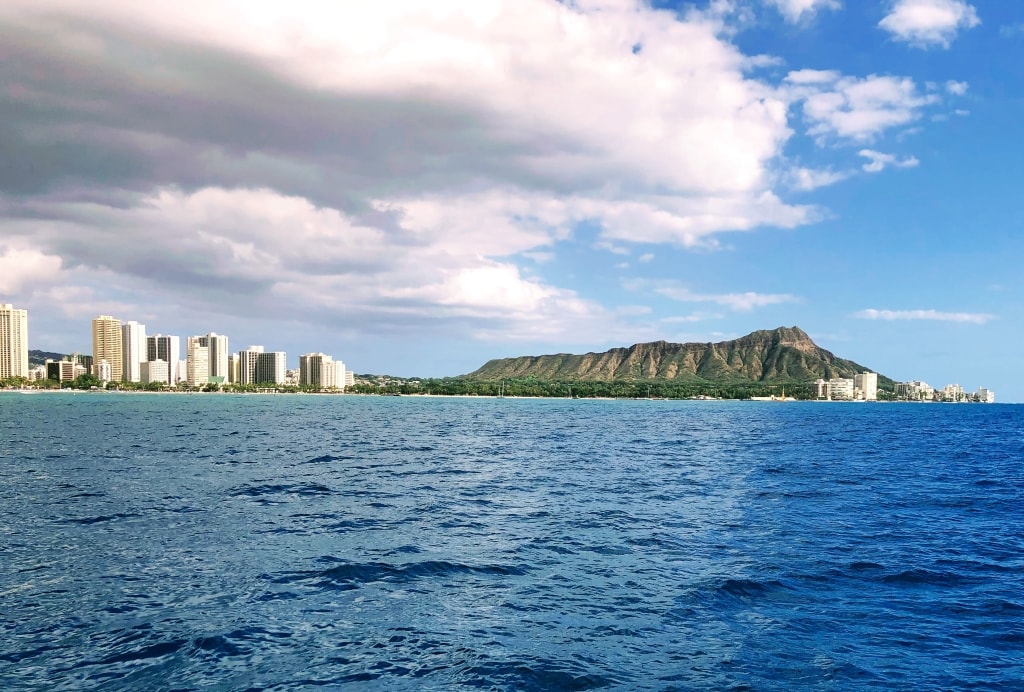 Views of Waikiki and Diamond Head Crater in Oahu from our catamaran boat during  Waikiki snorkeling tour